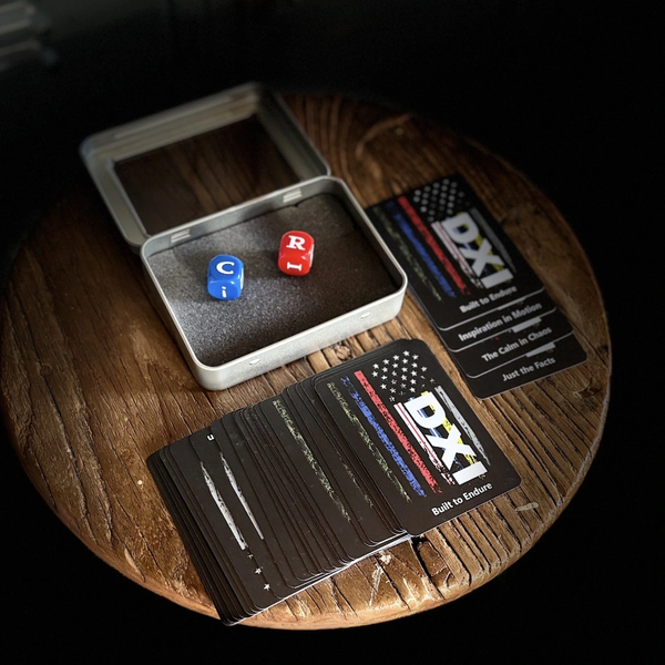 Dice and DXI cards on a wooden table.