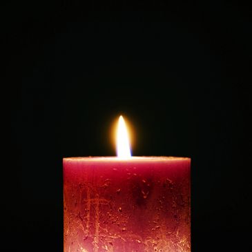 A beautiful picture of a candle in the dark