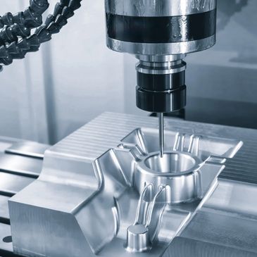 CNC machine precisely milling a metal component.