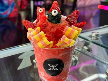 Creative seafood dessert with candy and fruit.