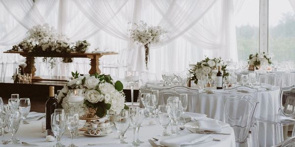 White Wedding tables for a Montreal Wedding by Eastwood Events. Wood tables, white flowers, ghost ch