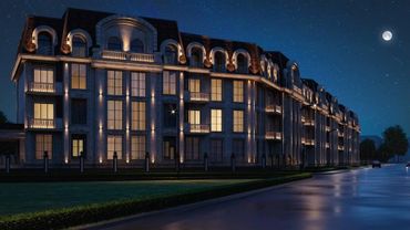 Elegant mansion illuminated at night under a starry sky with moon.