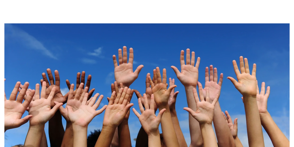 Peoples hands raised in the air.