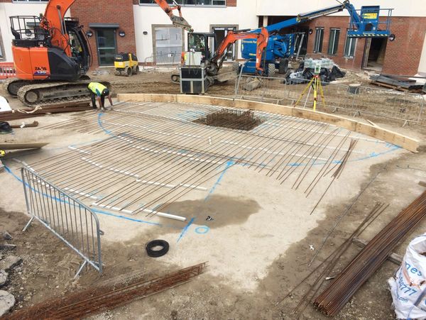 A construction site with engineers and machinery