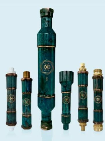 A set of six green cylindrical water filters with gold accents.