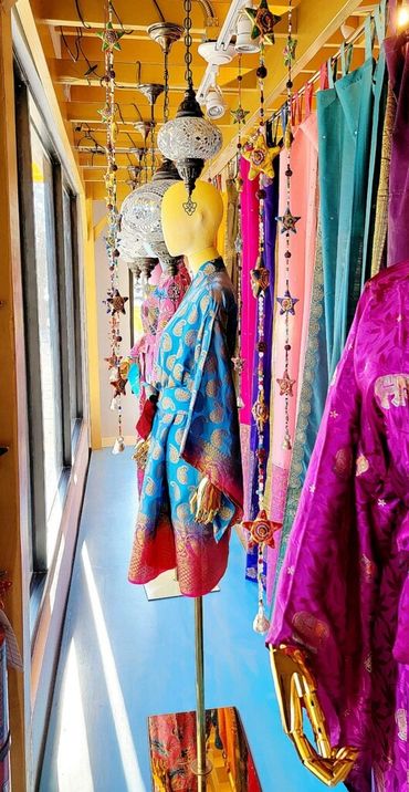 Saree silk kimonos Star Garlands in window display.