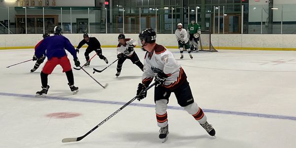 Ice hockey players in action on the rink during a game.