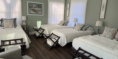 One of our large bedrooms with 3 twin xl beds and one queen bed