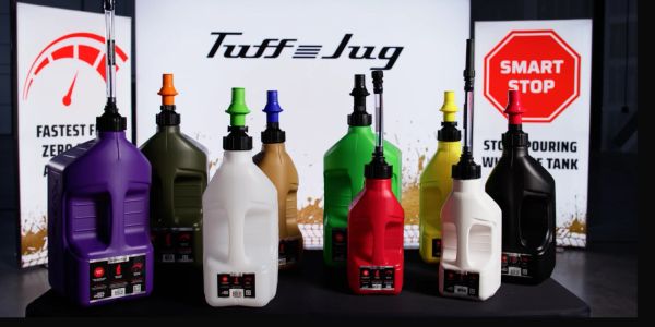 Colorful Tuff Jug fuel containers with smart stop signs.
