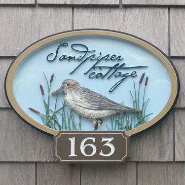 The Sandpiper Cottage - hand carved wooden street number sign on South Village Road 