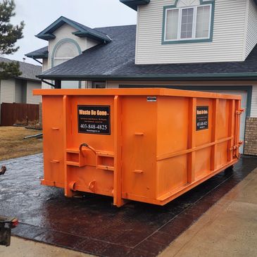dumpster rented in the front driveway used for junk removal. our bin was rented for 7 days.  