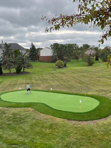Northville Michigan putting green with a double fringe installations near me with artificial turf