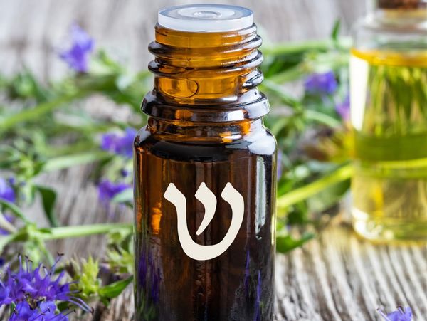 a bottle of healing oil on a wooden table. 