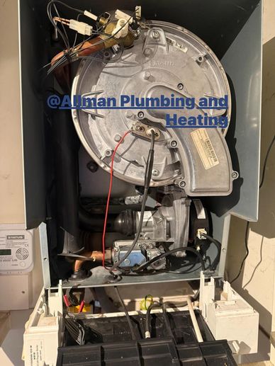 Open heating unit with visible wiring and components.