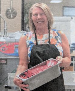 Susan holding a freshly made pan of berry gelato