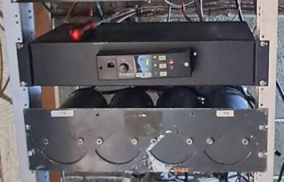 Electronic equipment mounted on a rack shelf.