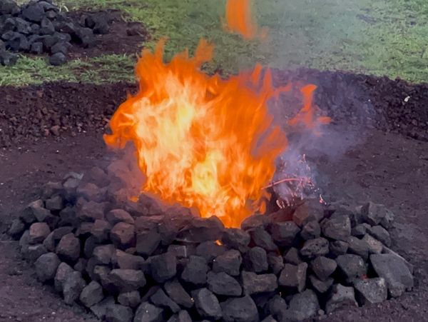 Fire burning on a pile of rocks