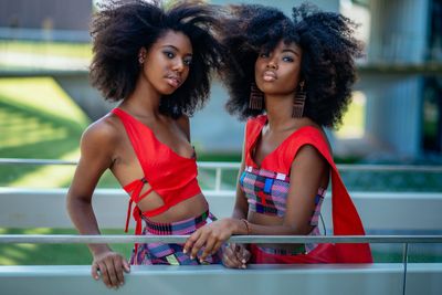 Two girls wearing beautiful clothes.