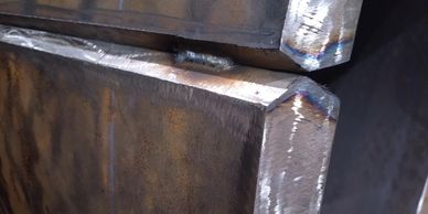 Close-up of welded steel edges with a metallic finish.