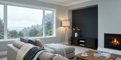 Cozy living room with a fireplace and large window.