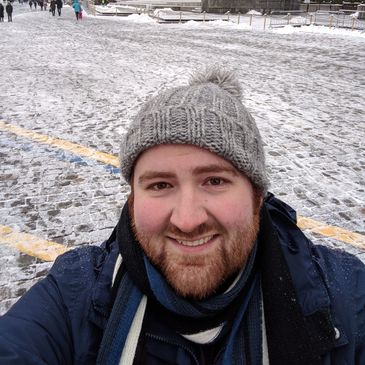 Elliot in Russia, visiting the Kremlin (with Saint Peter's in the background).