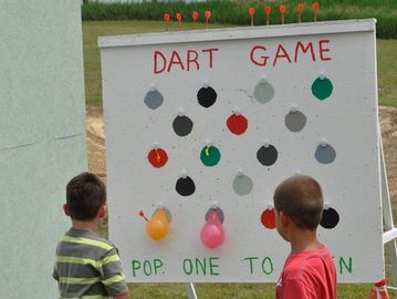 The Balloon Pop Dart Game is a popular carnival game rental, throw a dart and aim to pop a balloon.