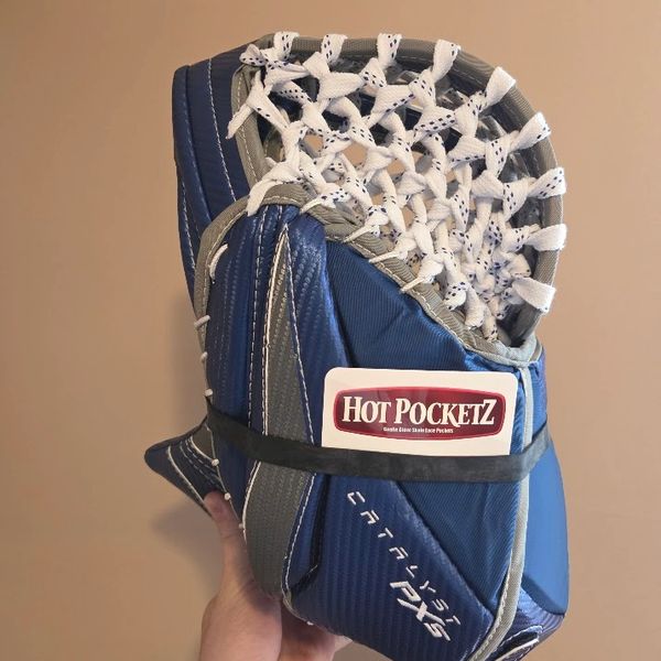 A blue and gray lacrosse goalie glove with a Hot PocketZ label.