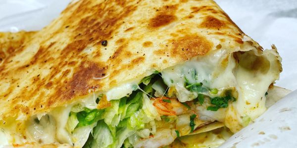 Large Meat Quesadilla filled with cheese, onions, cilantro. 