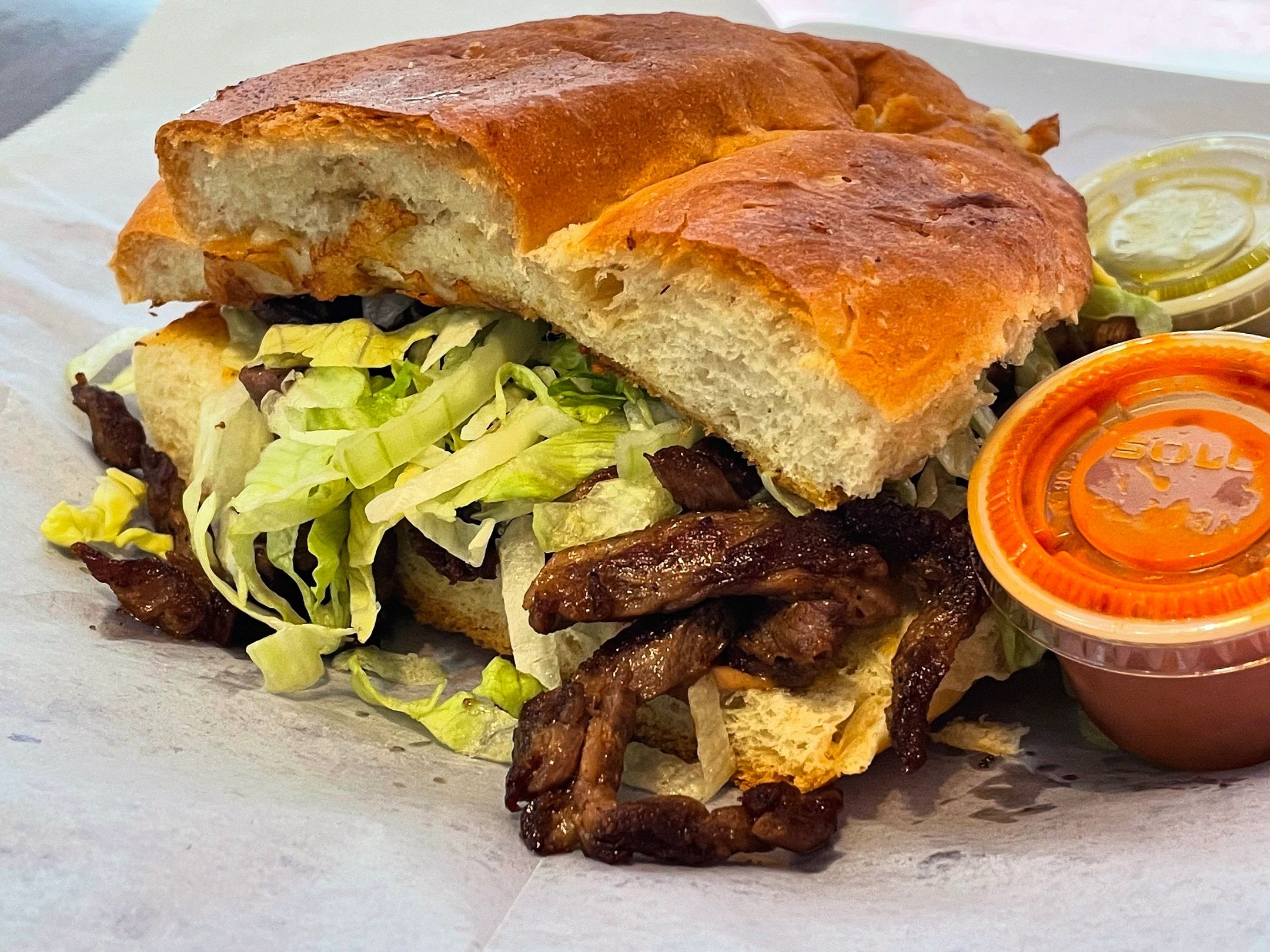 Torta.(Mexican Sandwich)
Telera bread filled with refried beans, choice of meat, lettuce, tomato, av