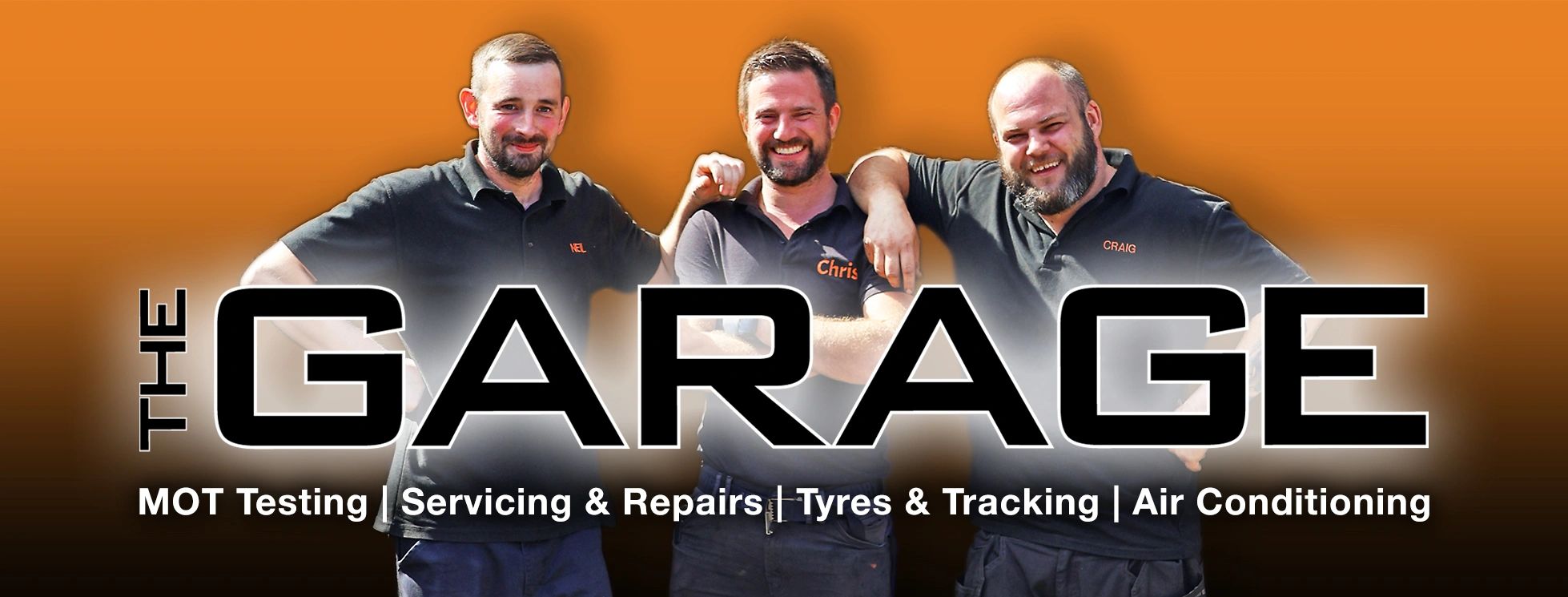 Three mechanics smiling with a garage service advertisement.