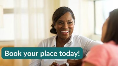 Woman of colour chatting with a cuppa in hand.