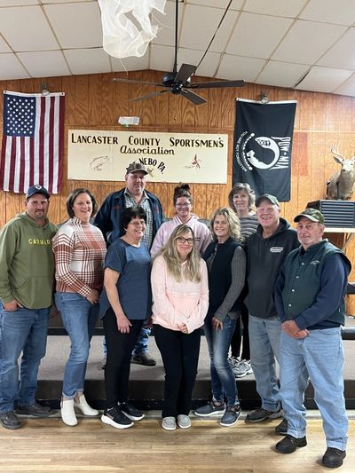 Group photo of ten people at Lancaster County Sportsmen's Association meeting.