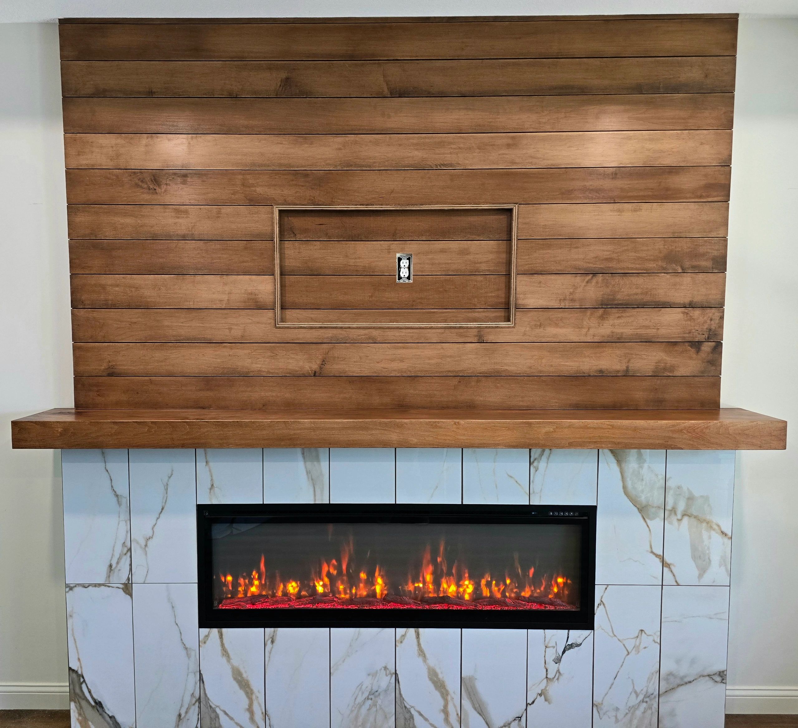 Custom accent wall fireplace. Custom Woodworking. Custom mantle. Living space accent. 