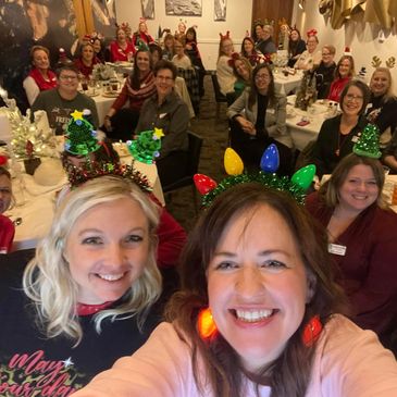 Group celebrating with festive headbands and smiles.