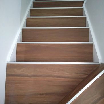 Staircase done in Spotted gum Hybrid flooring with silver stair nosings