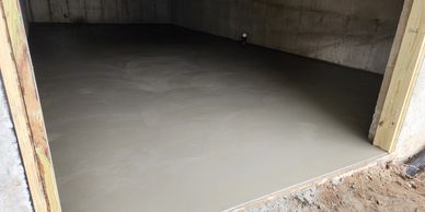 New concrete garage slab providing a clean, durable base for future finishes.