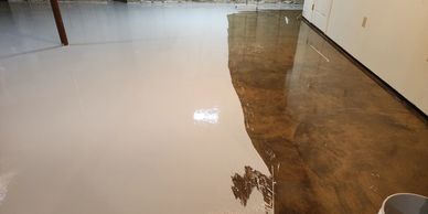 Basement floor waterproofing system controlling moisture and preparing slab for finishes.