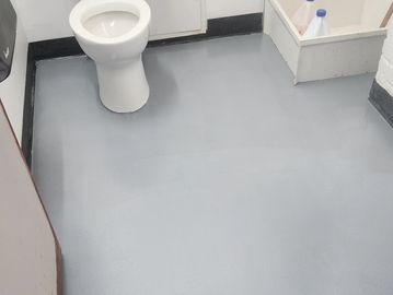 Non-slip utility bathroom in Boston, MA. Durable and easy to clean.