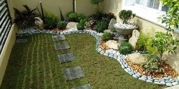 Lawn landscaping services creating green, healthy lawns with proper leveling and design