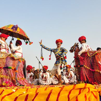 Traditional Rajasthani folk dance with vibrant costumes and cultural props.