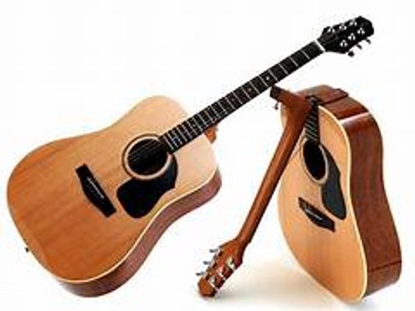 Two wooden acoustic guitars positioned on a white background.