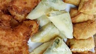 A selection of Hot Hors d'Oeuvres - coconut shrimp, spinach & feta phyllo triangles 