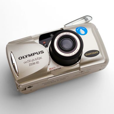 An silver-coloured Olympus film camera