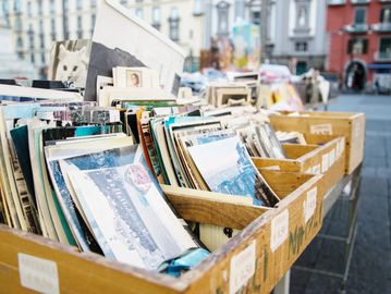 Many printed photos in some boxes that are ready to be scanned