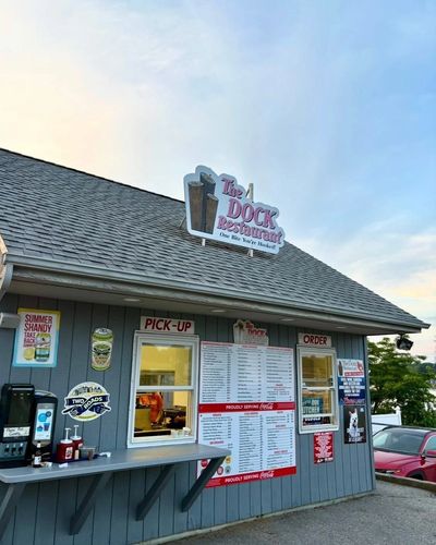 The Dock Restaurant with pick-up and order windows and a menu on the side.