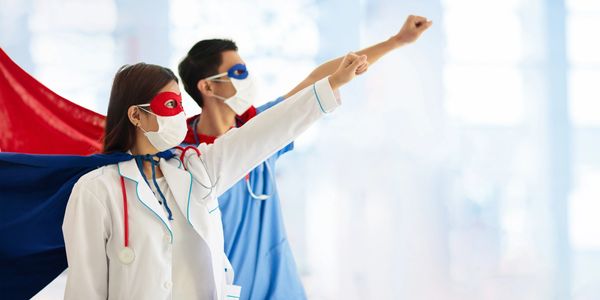 Nurses and Medical workers dressed in hero capes and masks.