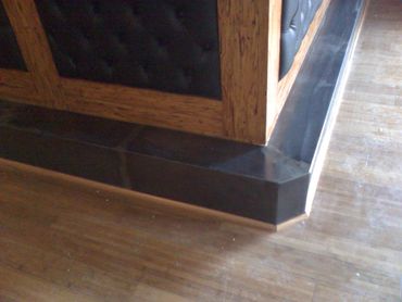 steel formed and patina-ed toe kick for bar