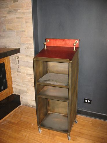 distressed steel front of house podium with bronze accents