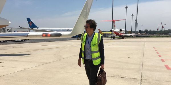 Someone walking around a private jet