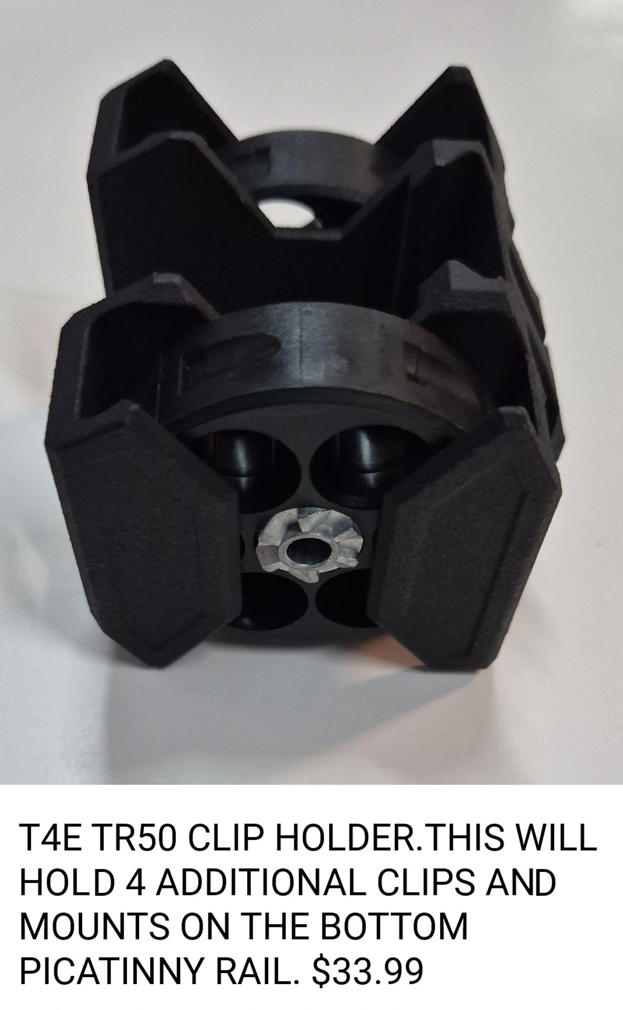 T4E TR50 clip holder for 4 clips, mounts on Picatinny rail.